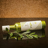 Bottle of Organic Olio di Puglia organic olive oil on its side with decorative background
