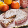 Panforte di siena displayed with one slice cut.