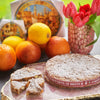 Whole panforte di siena displayed next to a sliced panforte.