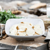 Bowl of Croxetti pasta with decorative background