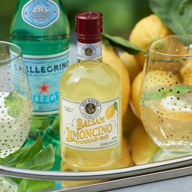 Bottle of Balsam Limoncino Limoncello Vinegar with decorative background