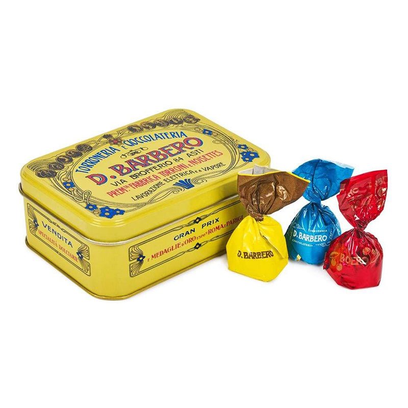 Individually wrapped filled chocolates in primary coloured sweet wrappers. Beautiful D.Barbero Italian vintage style yellow keepsake tin.