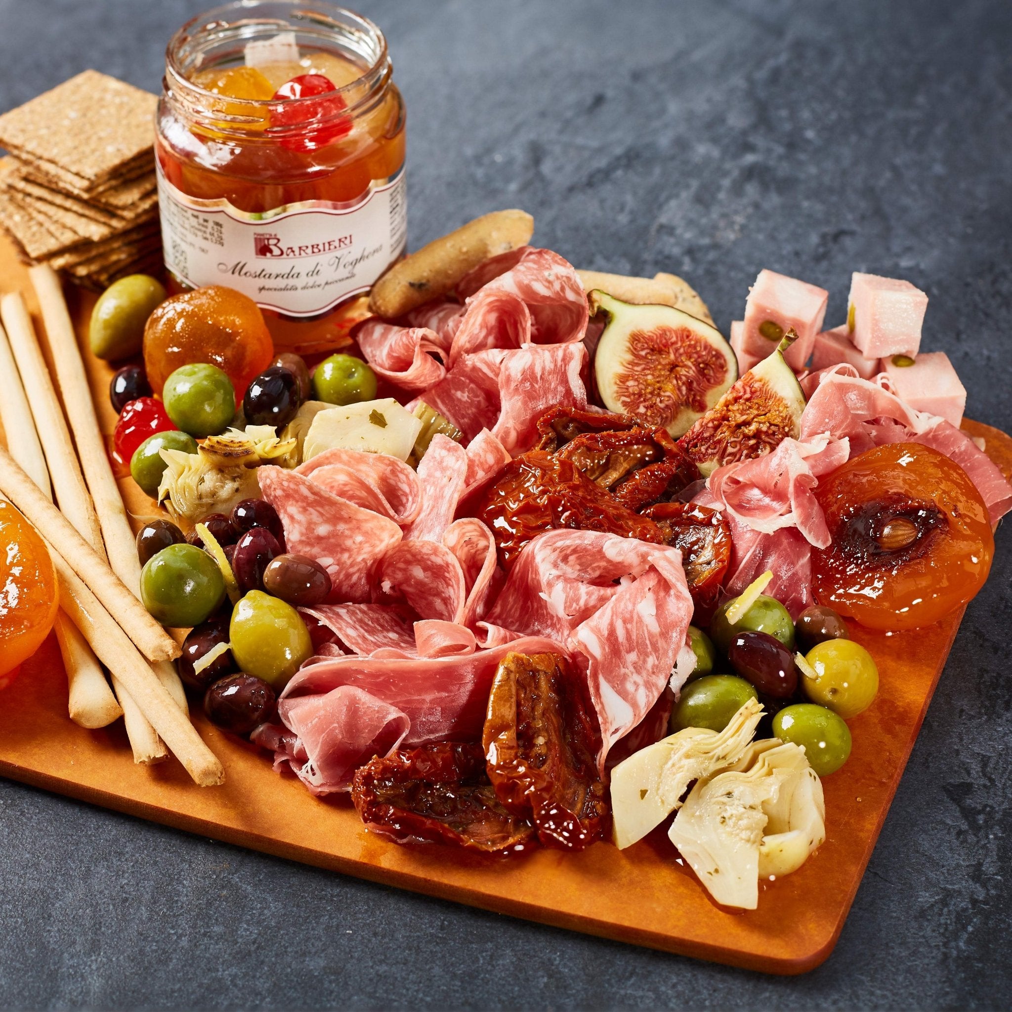 Mostarda platter with meat and anti-pasti.