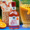 Bottle of Balsam Spritz Mocktail Drinking Vinegar with decorative background