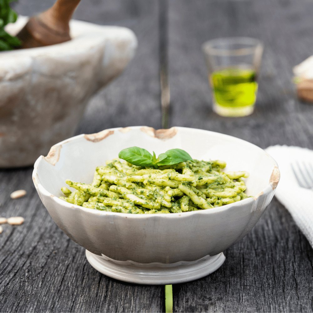 Bowl of Trofiette pasta with decorative background