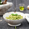 Bowl of Trofiette pasta with decorative background