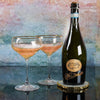 Prosecco DOC bottle and two poured glasses.